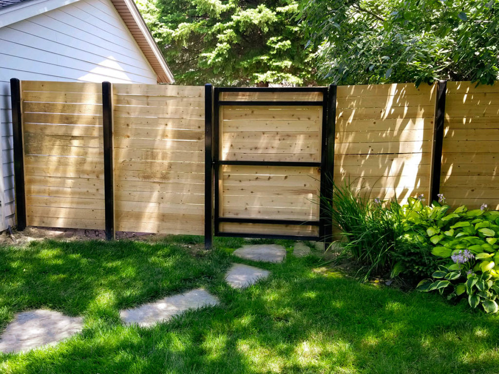 Custom wood fencing Omaha, Nebraska fence company residential fence contractors Omaha cedar western red cedar treated pine white red yellow CCA  ACQ2 incense fir 2x4 1x6 2" x 4"  1" x 6"  nails stain solid privacy picket scalloped board on board shadow box pickets rails posts installation panels post caps modern horizontal backyard front yard ranch gate garden diy split rail house lattice old rustic vertical metal post picket dog ear contemporary custom