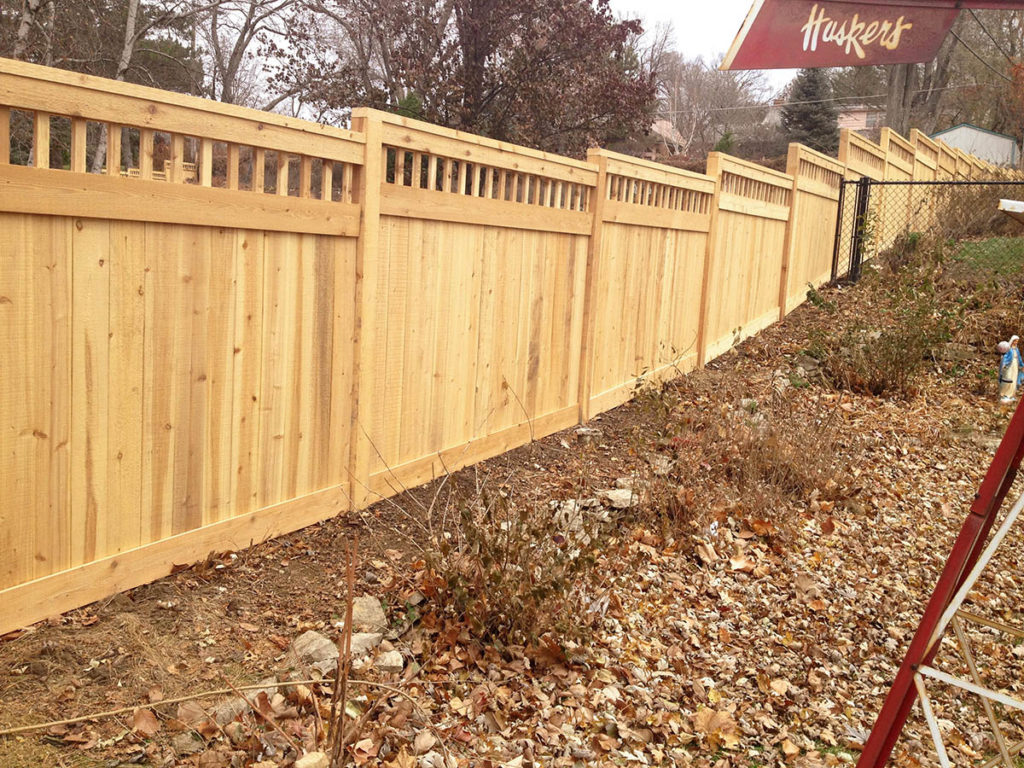 Omaha fence contractors residential fence company Nebraska wood fencing cedar western red cedar treated pine white red yellow CCA ACQ2 incense fir 2x4 1x6 2" x 4" 1" x 6" nails stain solid privacy picket scalloped board on board shadow box pickets rails posts installation panels post caps modern horizontal backyard front yard ranch gate garden diy split rail house lattice old rustic vertical metal post picket dog ear contemporary custom